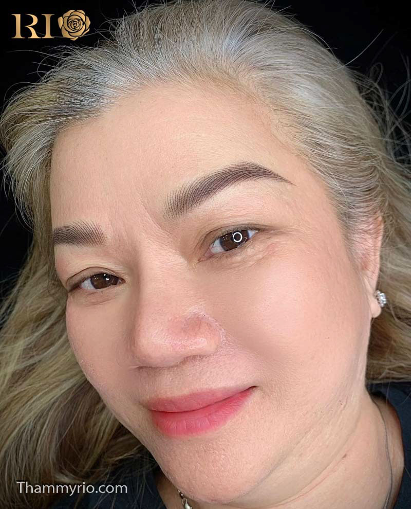 Artist Master performing Anti-Aging Eyebrow PMU to create a rejuvenating and lifting effect for mature clients