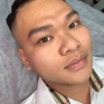 Artist Master Mely Thao customizing men's eyebrow shapes based on individual facial structure analysis