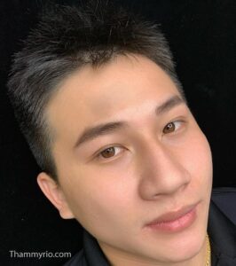 Close-up of a man's defined and well-groomed eyebrows after a microblading procedure.