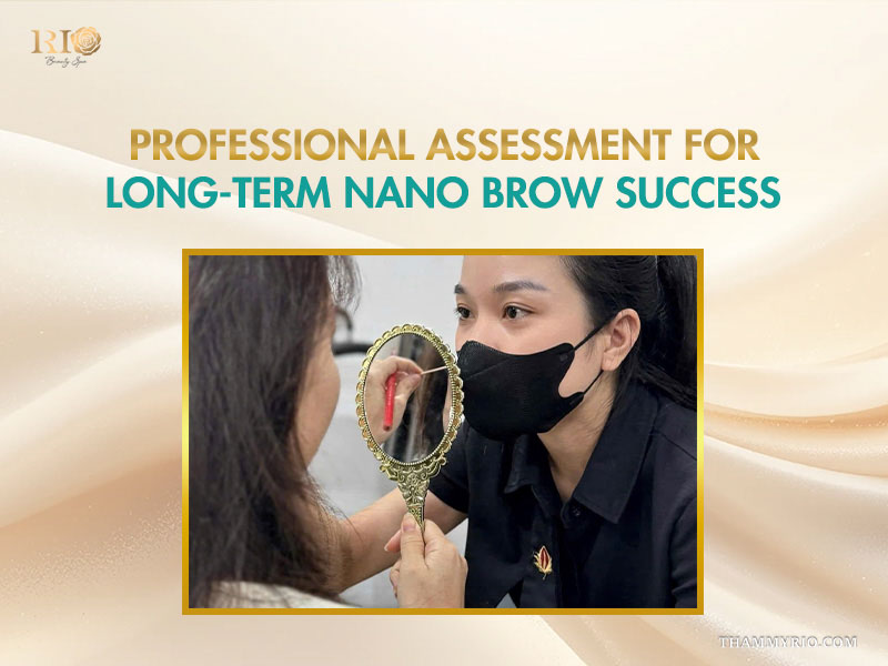 Professional artist assessing faded nano brows in a handheld mirror for a touch-up session.