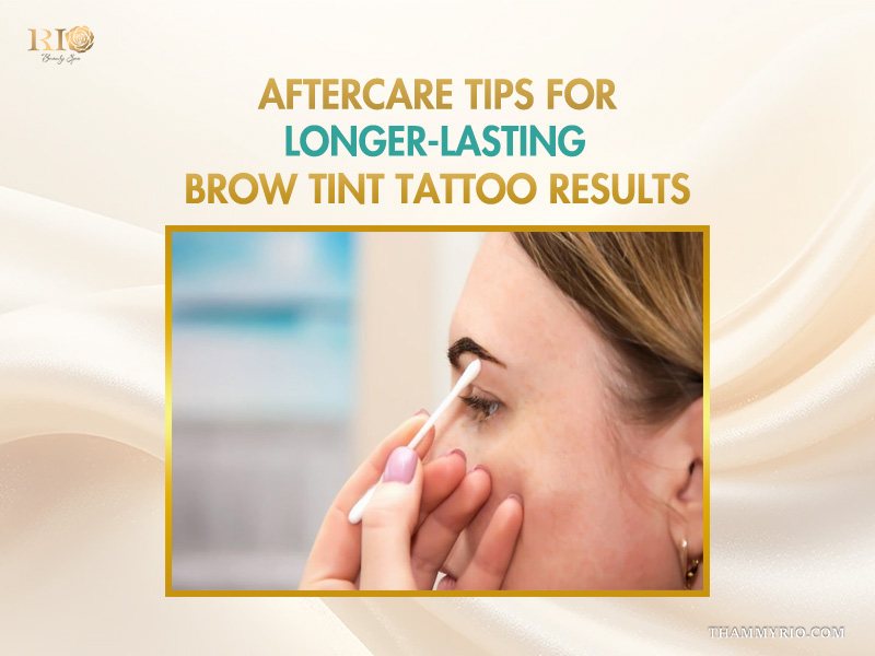 Person using a cotton swab for eyebrow tint tattoo aftercare to ensure long-lasting results.