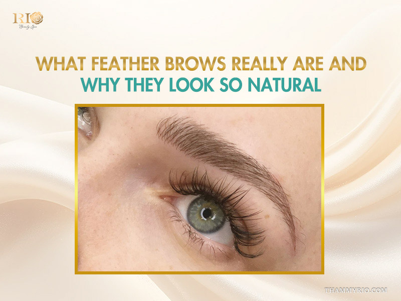 Close-up of natural-looking feather brows with fine hair strokes and long lashes.