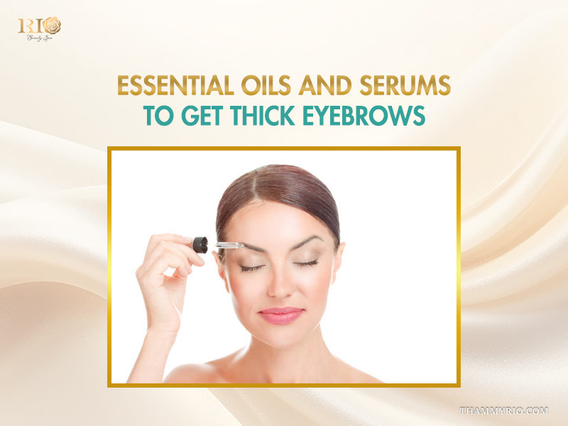 A woman applying a dropper of serum to her brow as part of using essential oils and serums to get thick eyebrows.