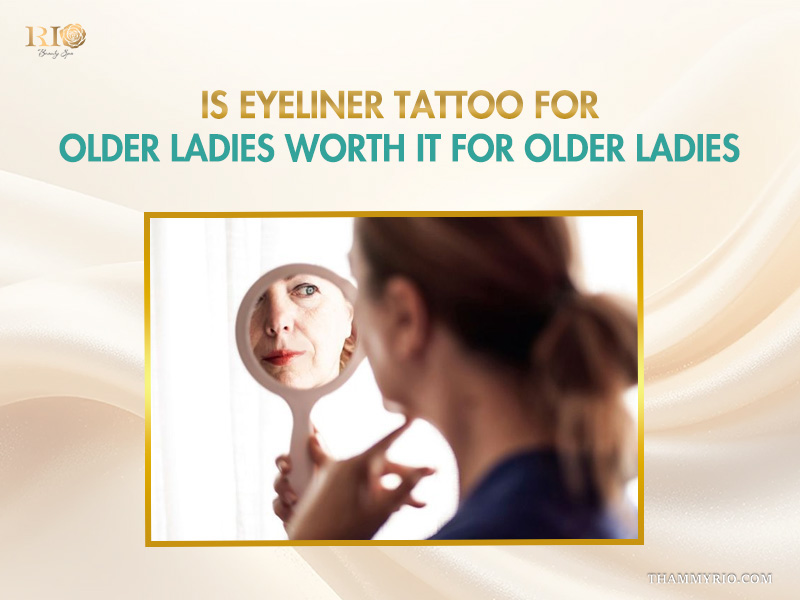 An older woman looking in a mirror considering permanent eyeliner for aging eyes.