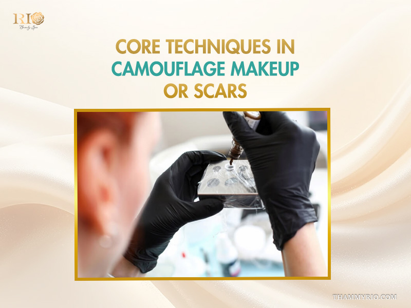 Professional camouflage scar makeup artist mixing specialized pigments for skin tone matching.