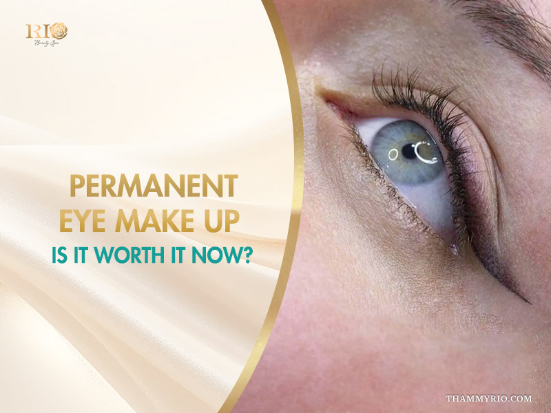 Close-up of blue eye with professional permanent eye make up eyeliner.