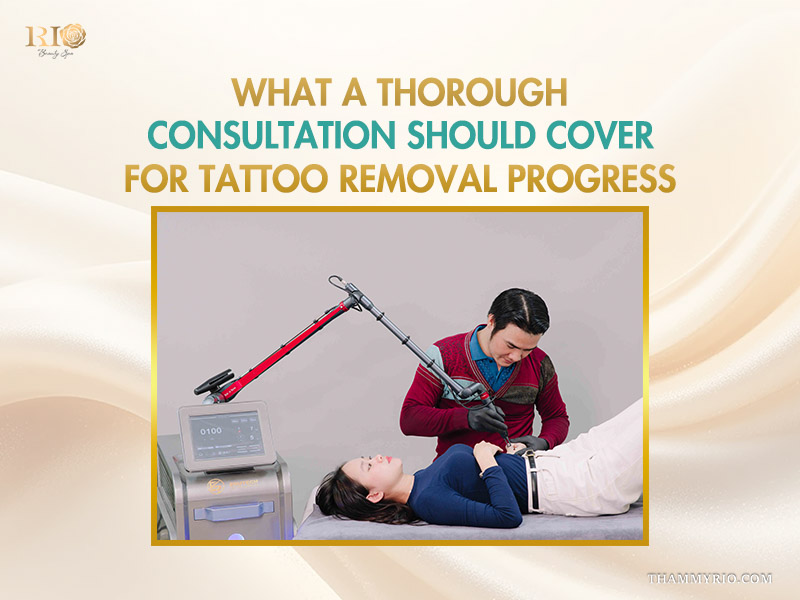 Professional specialist performing a laser treatment and consultation for tattoo removal progress.