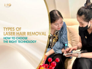 An aesthetician consulting an international client about types of laser hair removal in a modern treatment room.
