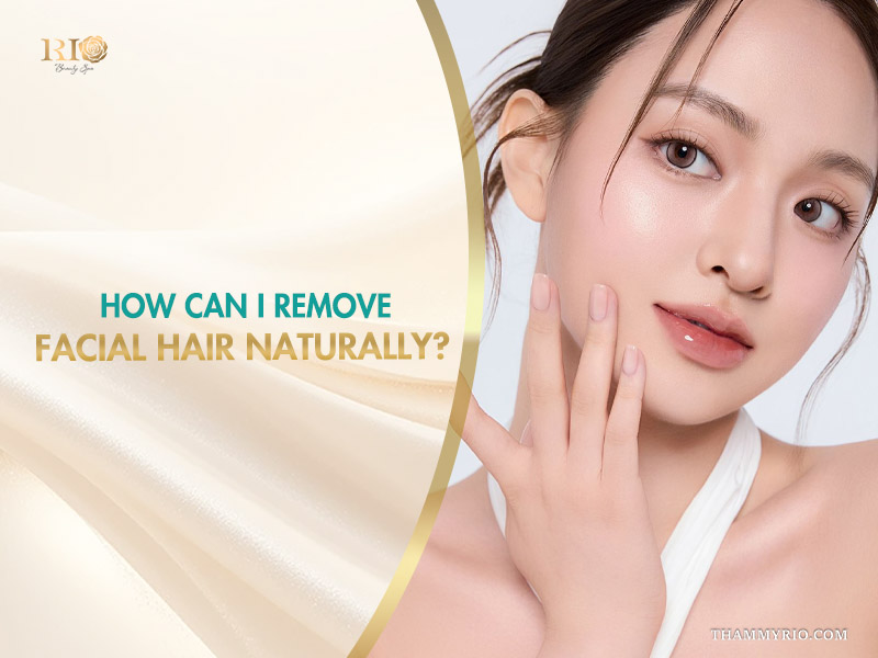 A woman with smooth, flawless skin touching her face, representing the question how can i remove facial hair naturally next to the Rio Beauty Clinic logo.