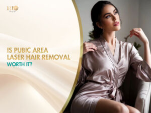 A confident young woman in a silk bathrobe relaxes on a sofa, enjoying comfort after pubic area laser hair removal.