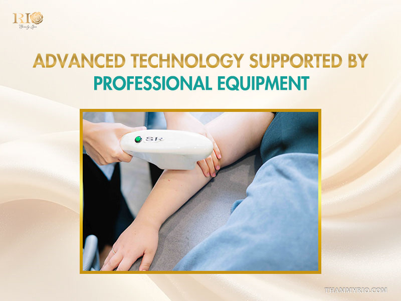 Close-up of a specialized laser treatment handpiece applied to a client's arm