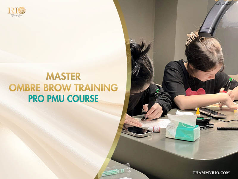Students practicing ombre brow training on latex skins with professional PMU machines.